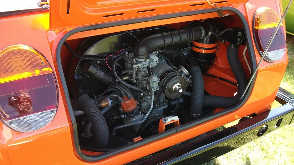 A rebuilt air-cooled Volkswagen flat-four engine on a stand.